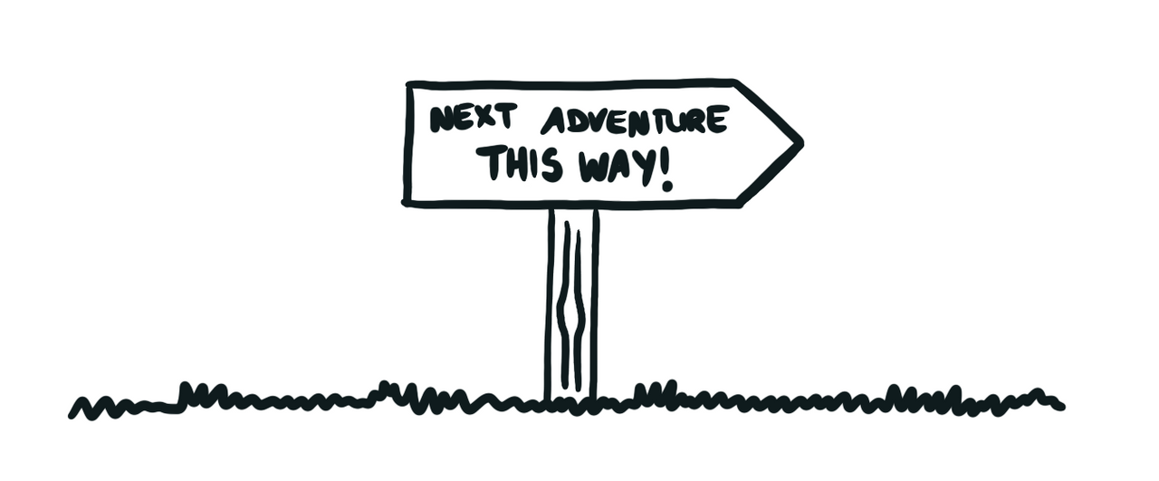 Directional signpost stating “Next adventure this way”